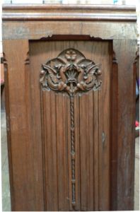 St Peter's: Pew - end carving