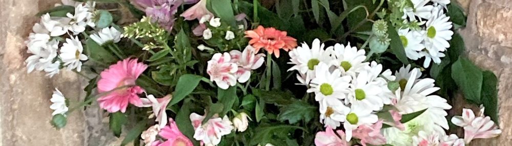 Flowers in pink and white arranged at St Peter's church, church langton