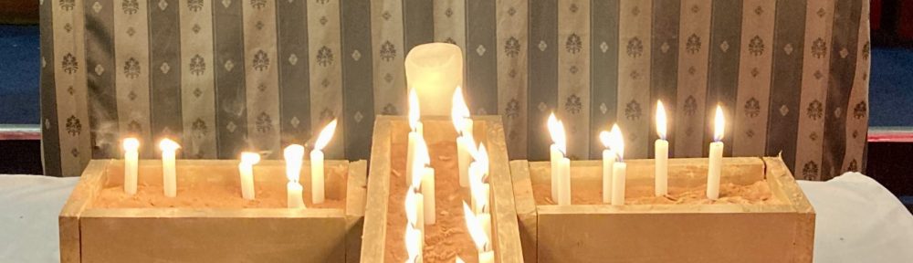 Photograph of the altar and candles for St Peter's All Souls service