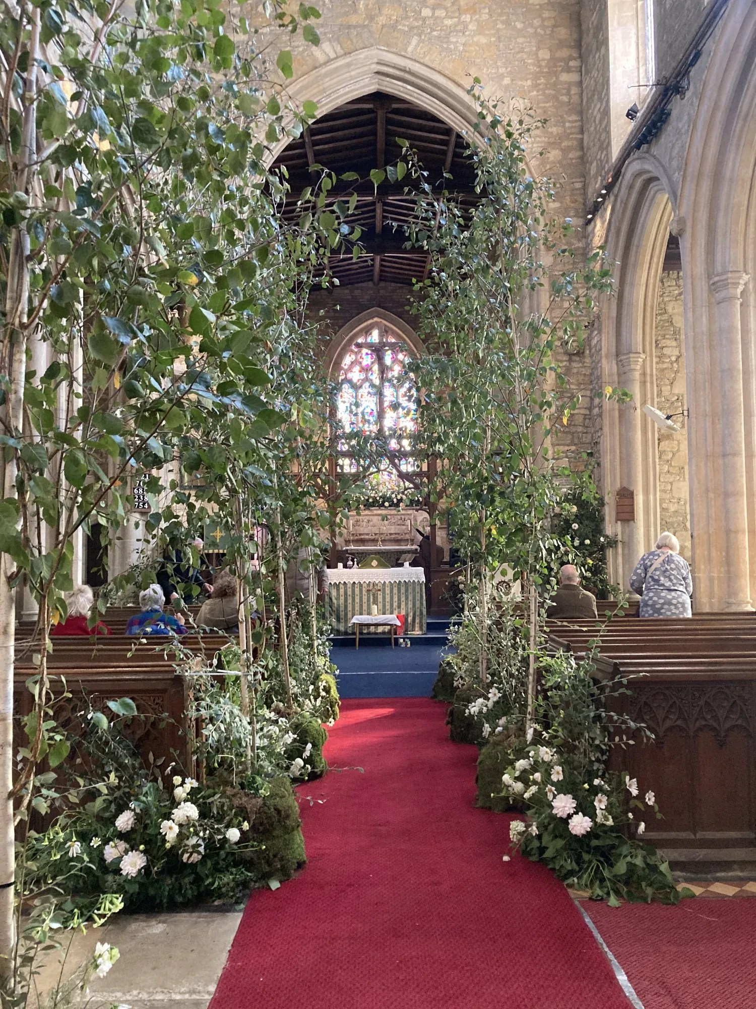 Silver birch trees in St Peter's Church for Harvest wedding. Photos copyright Maxine Dodd